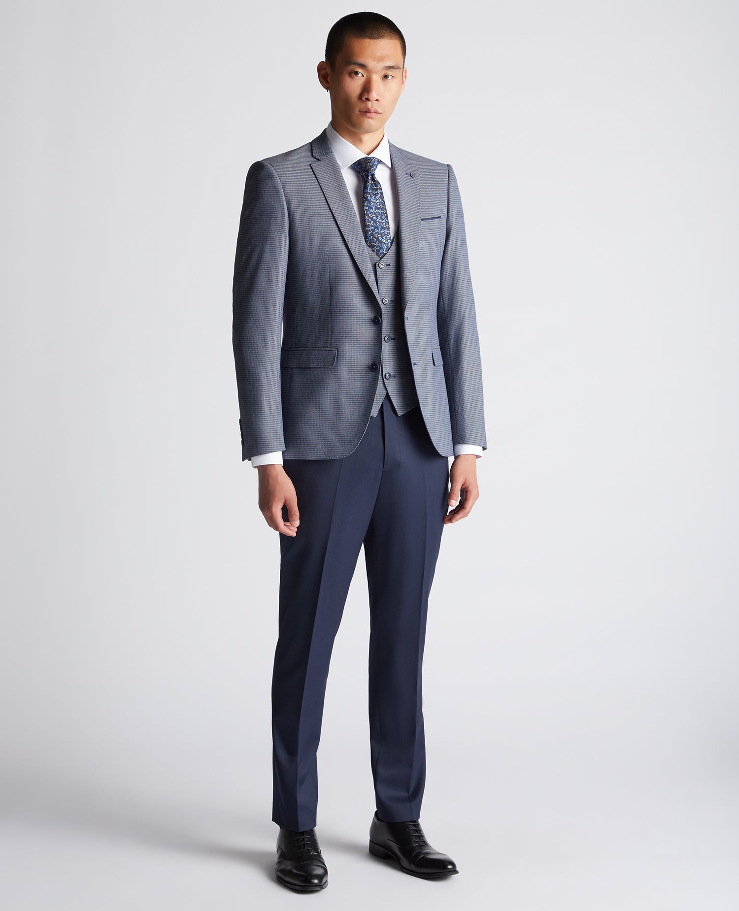 Man wearing a blue Slim Fit Stretch Mix and Match Suit Jacket
