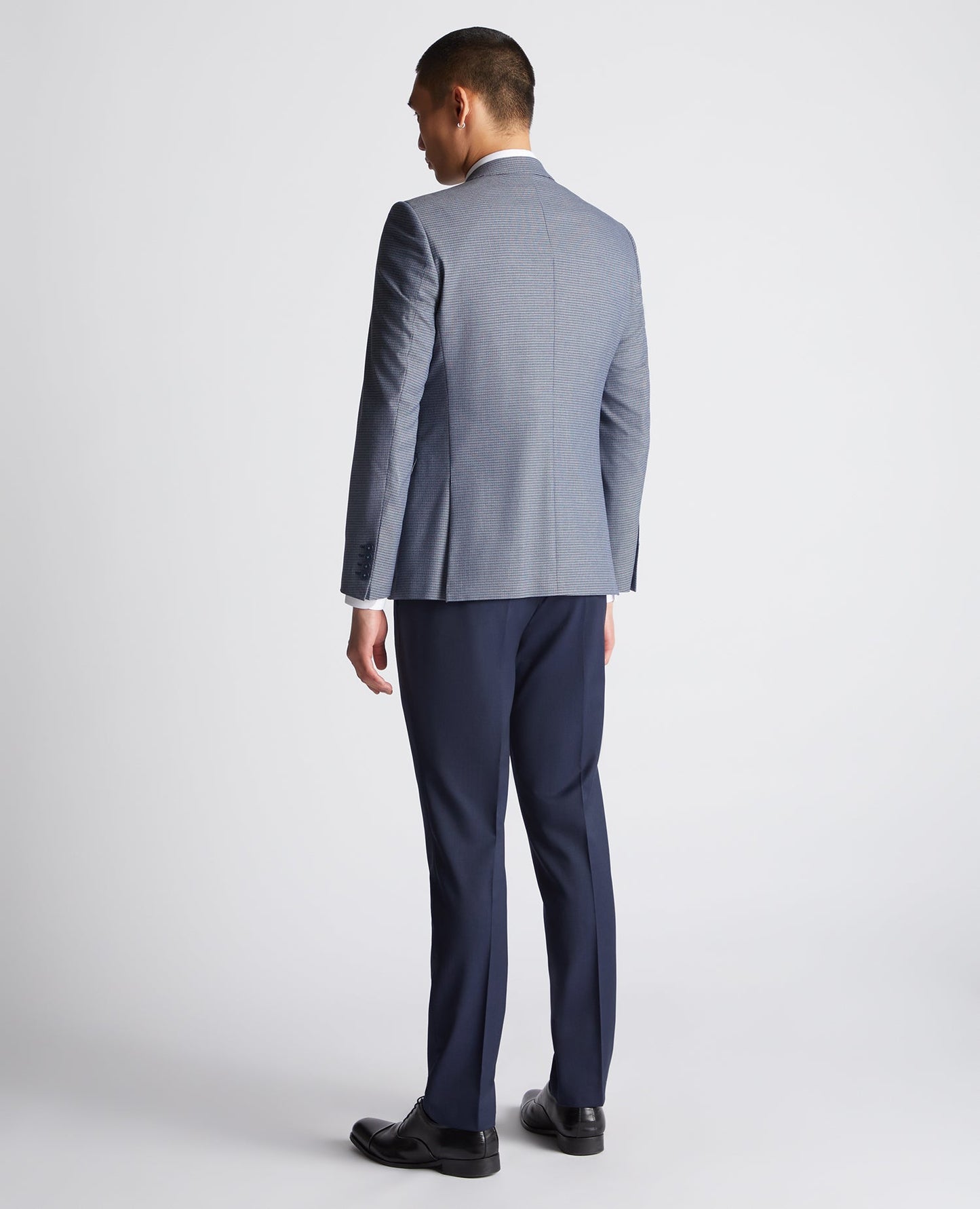 Man wearing a blue Slim Fit Stretch Mix and Match Suit Jacket