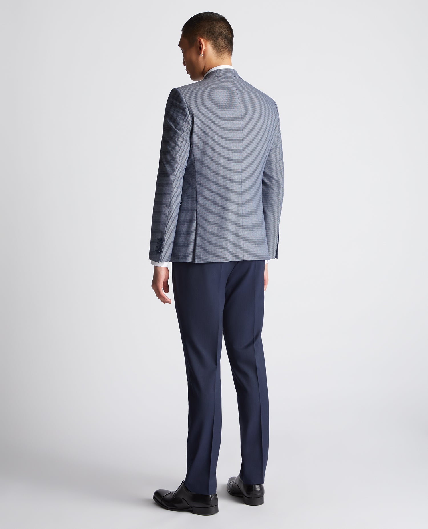 Man wearing a blue Slim Fit Stretch Mix and Match Suit Jacket