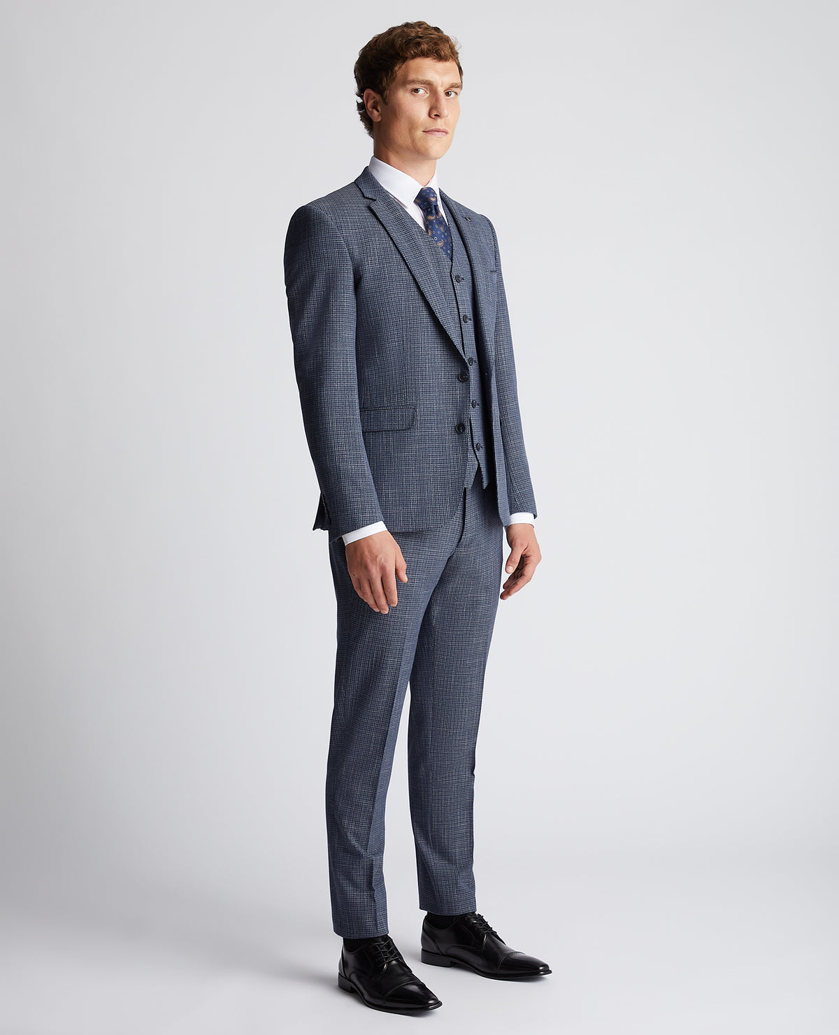 Man wearing a blue Slim Fit Checked Stretch Suit