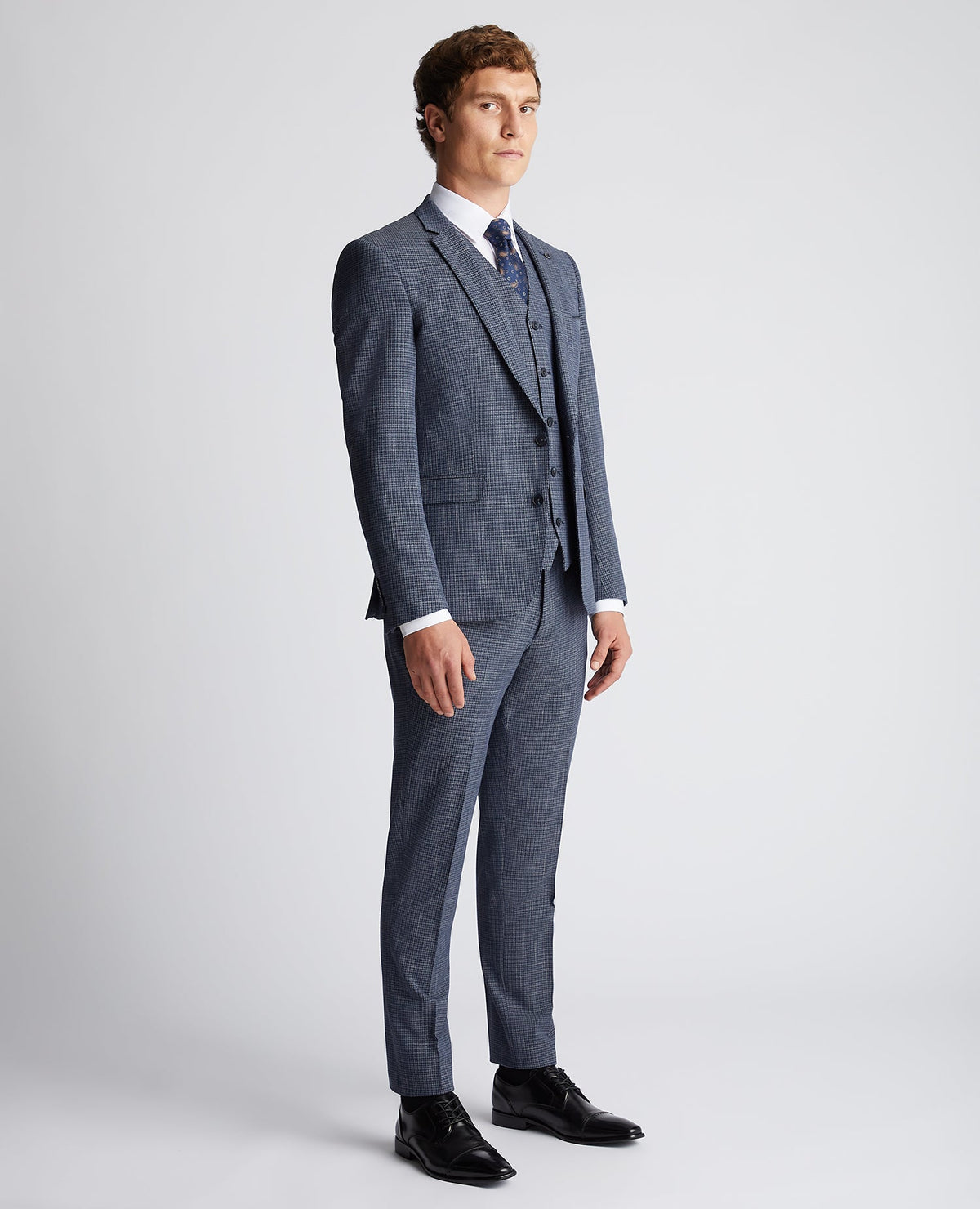 Man wearing a blue Slim Fit Checked Stretch Suit Jacket