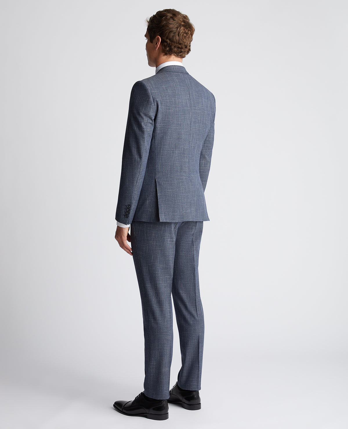 Man wearing a blue Slim Fit Checked Stretch Suit