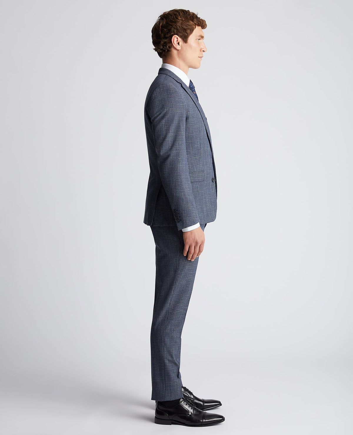 Man wearing a blue Slim Fit Checked Stretch Suit Jacket