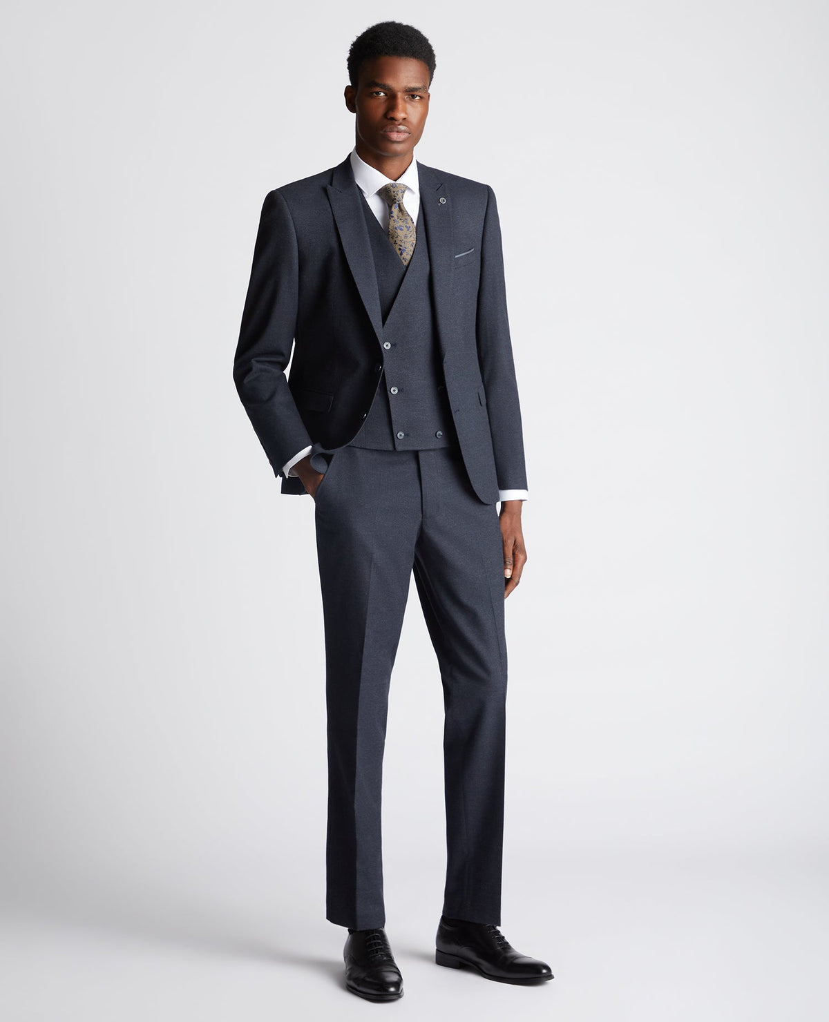 Man wearing a navy Slim Fit Stretch Suit