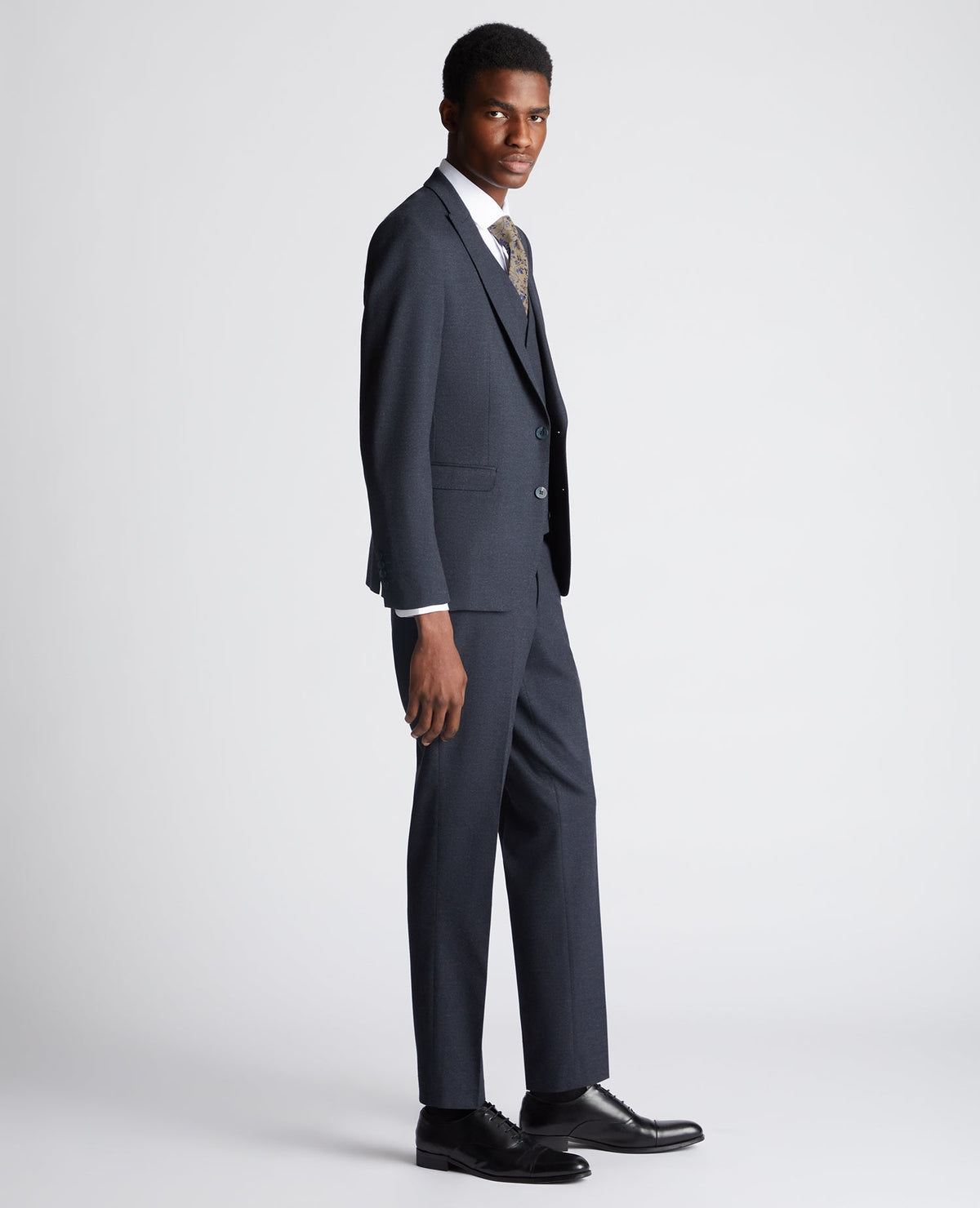 Man wearing a navy Slim Fit Stretch Suit