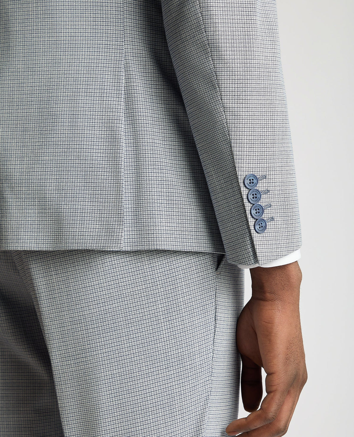 Man wearing a blue Slim Fit Micro Houndstooth Suit