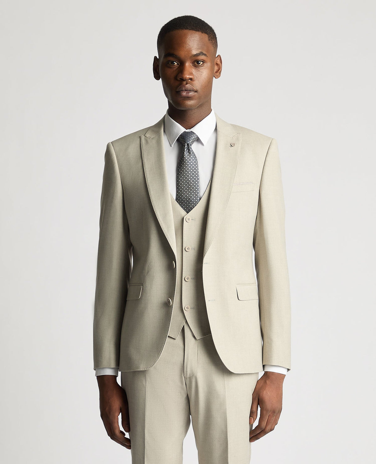 Man wearing a sand Slim Fit Stretch Suit Jacket