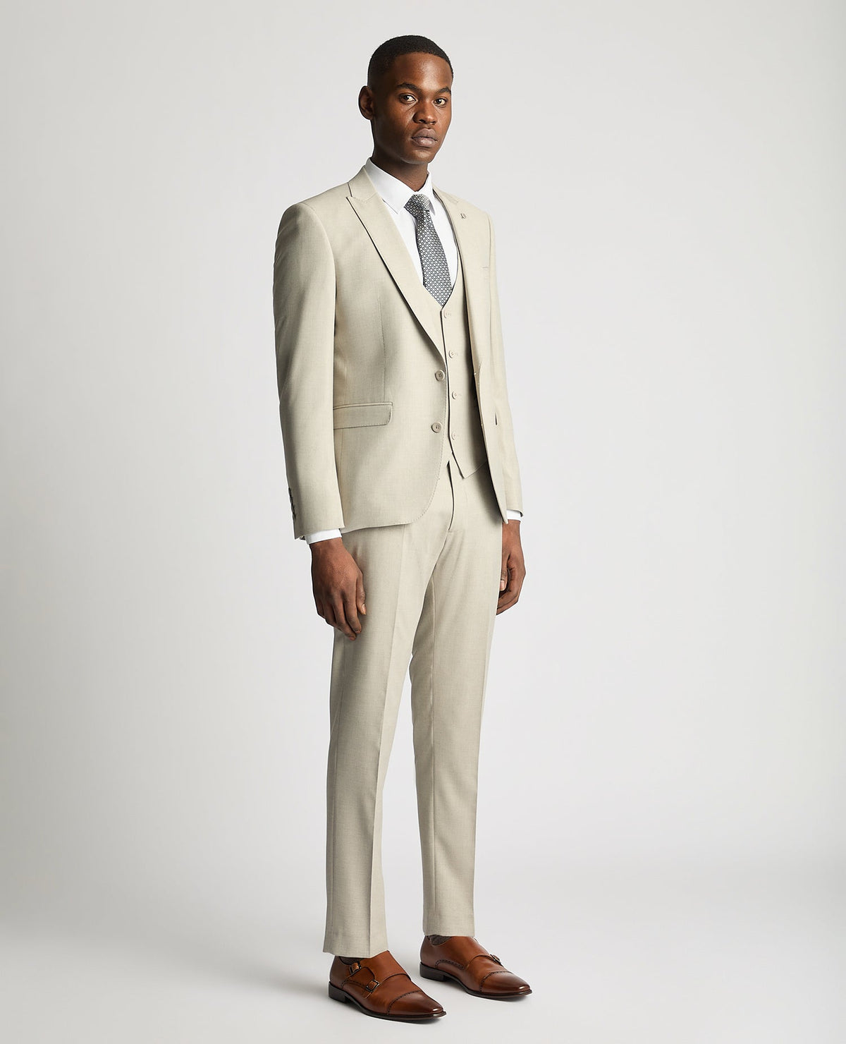 Man wearing a sand Slim Fit Stretch Suit Jacket