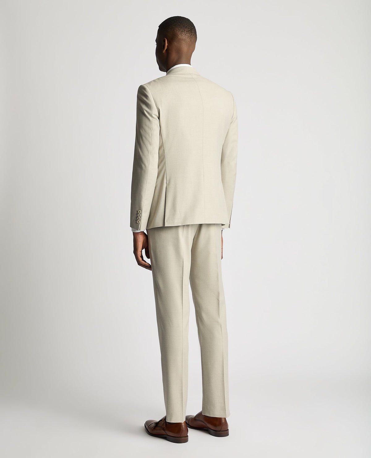 Man wearing a sand Slim Fit Stretch Suit Jacket