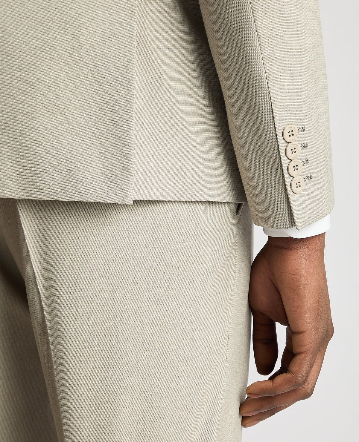 Man wearing a sand Slim Fit Stretch Suit Jacket