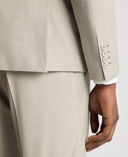 Man wearing a sand Slim Fit Stretch Suit Jacket