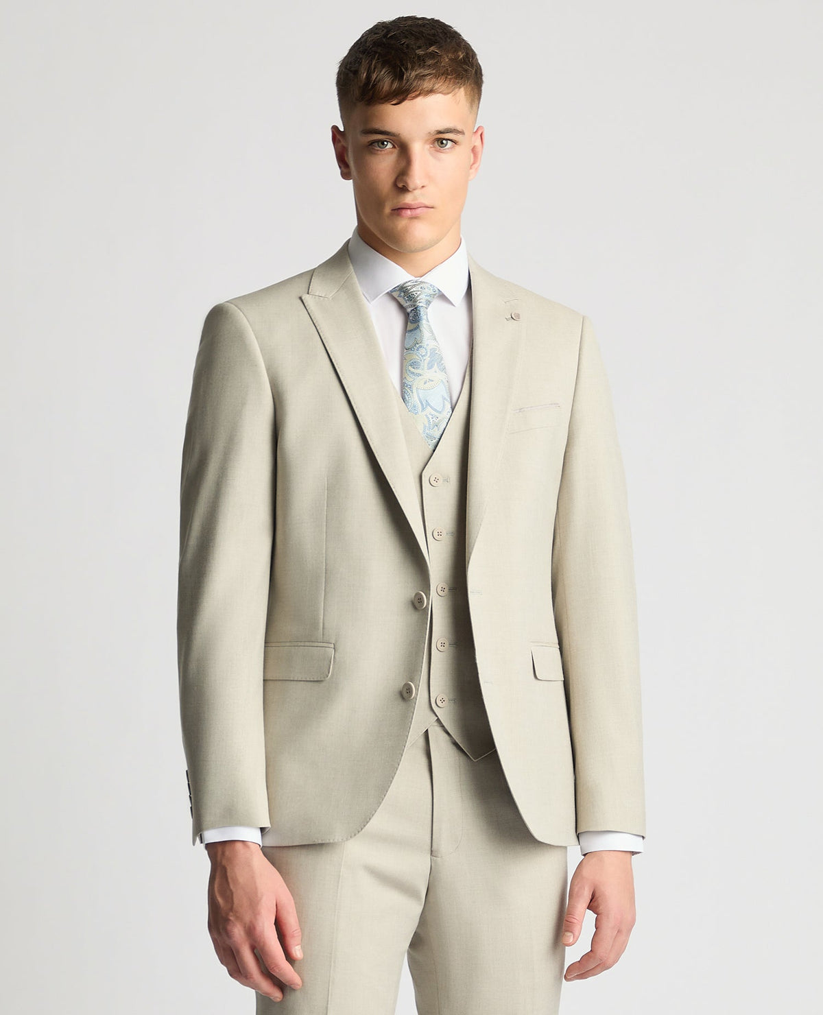 Man wearing a sand Tapered Fit Stretch Suit