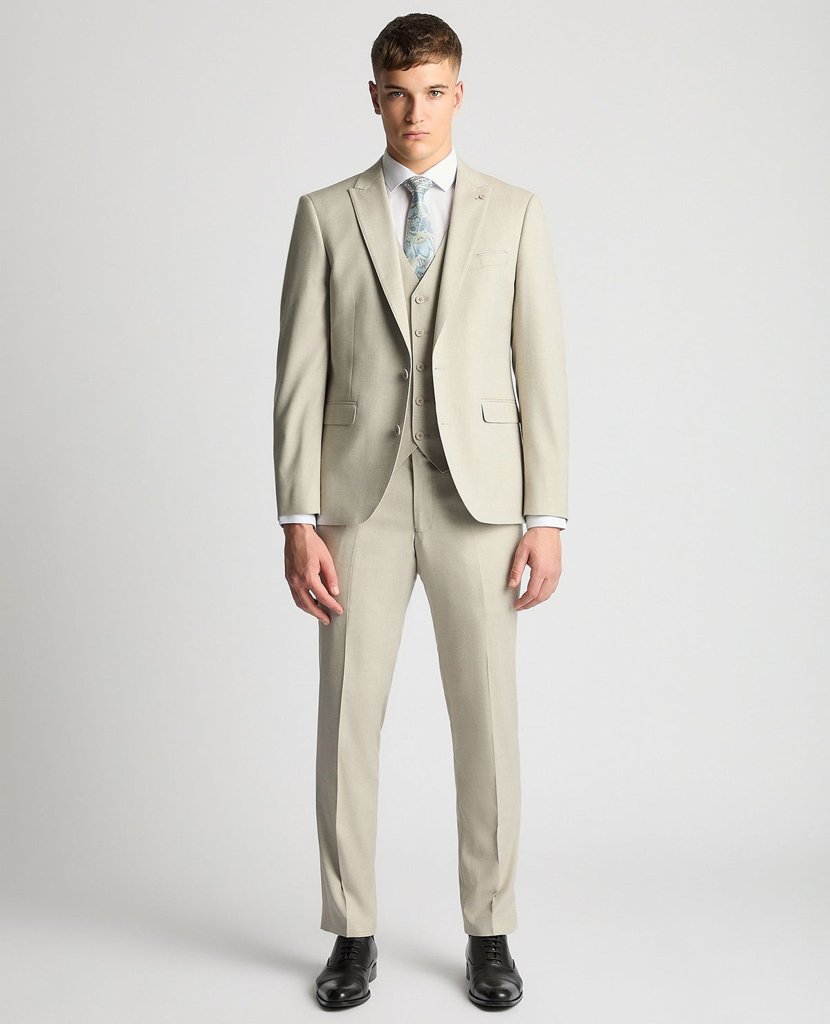 Man wearing a sand Tapered Fit Stretch Suit