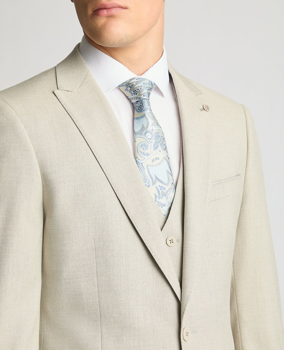 Man wearing a sand Tapered Fit Stretch Suit