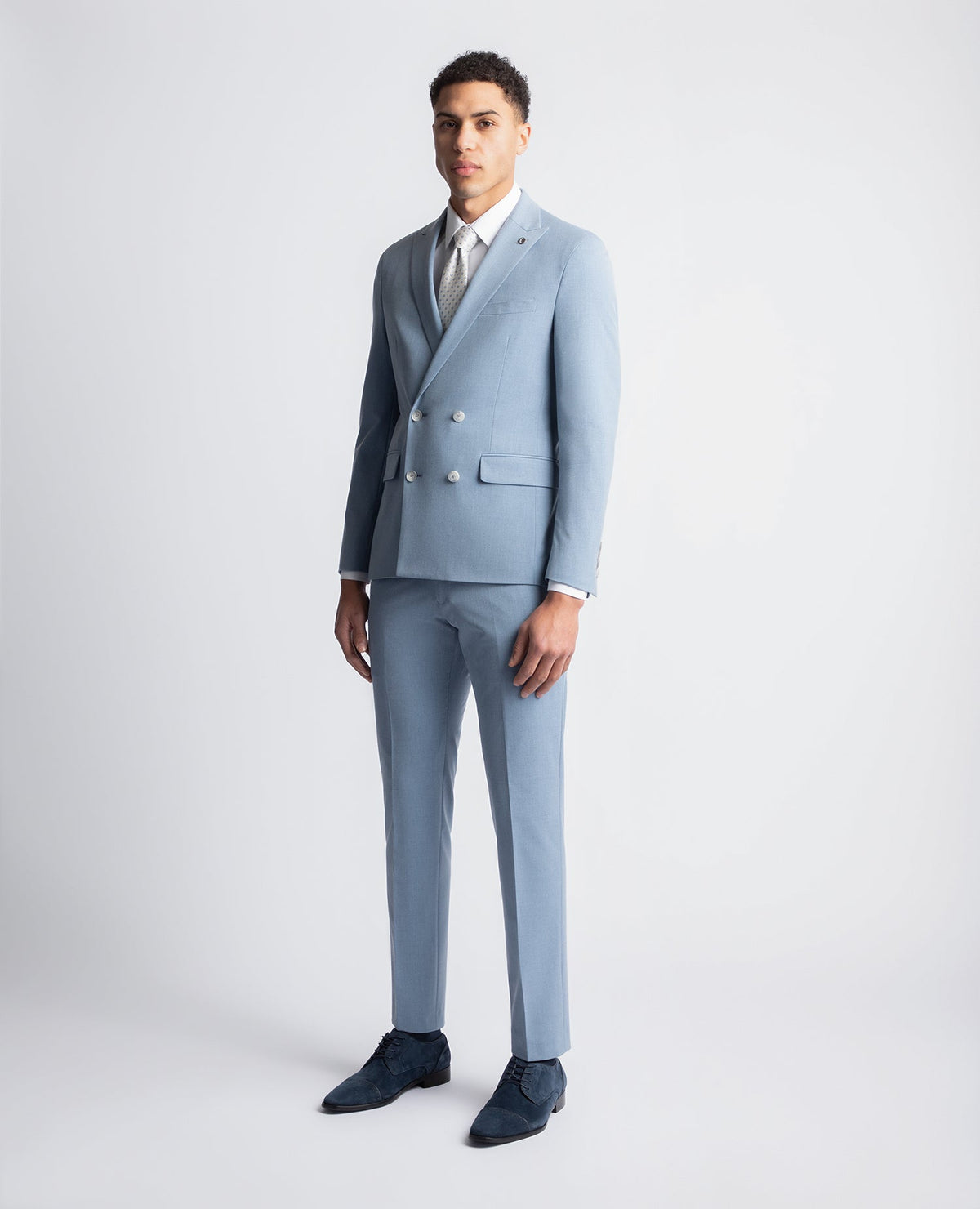 Man wearing a blue Slim Fit Stretch Double Breasted Suit Jacket
