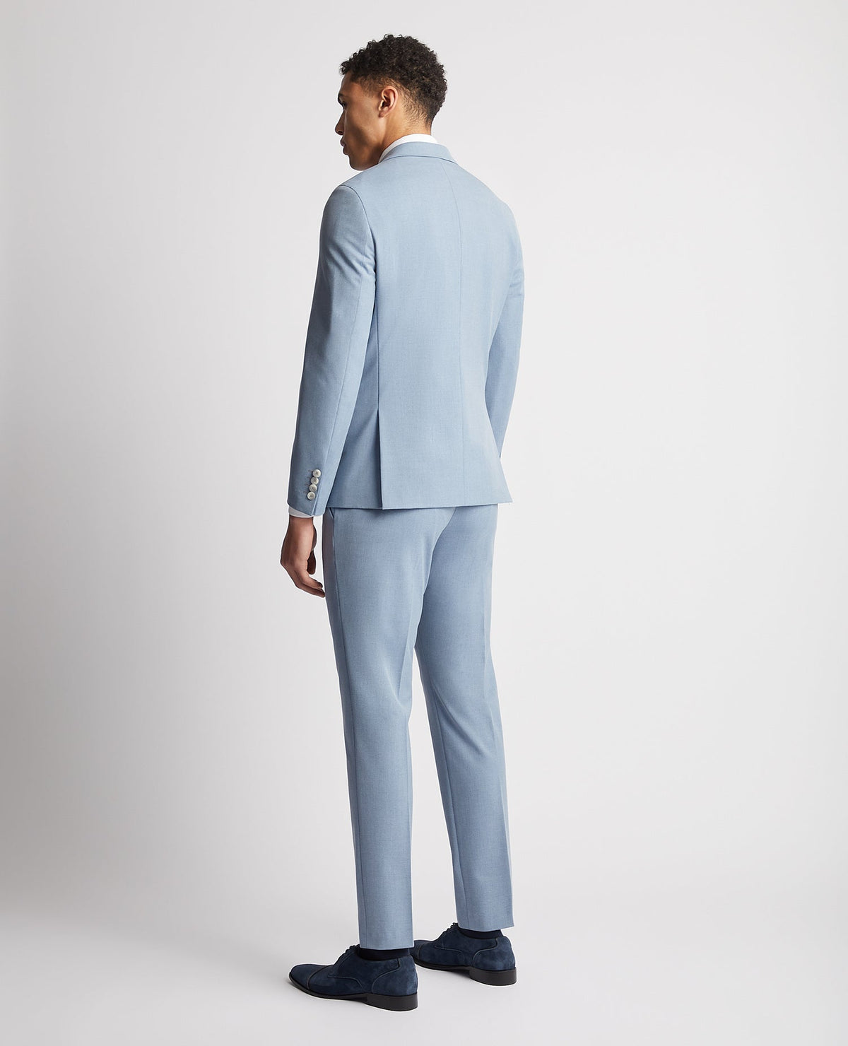 Man wearing a blue Slim Fit Stretch Double Breasted Suit Jacket