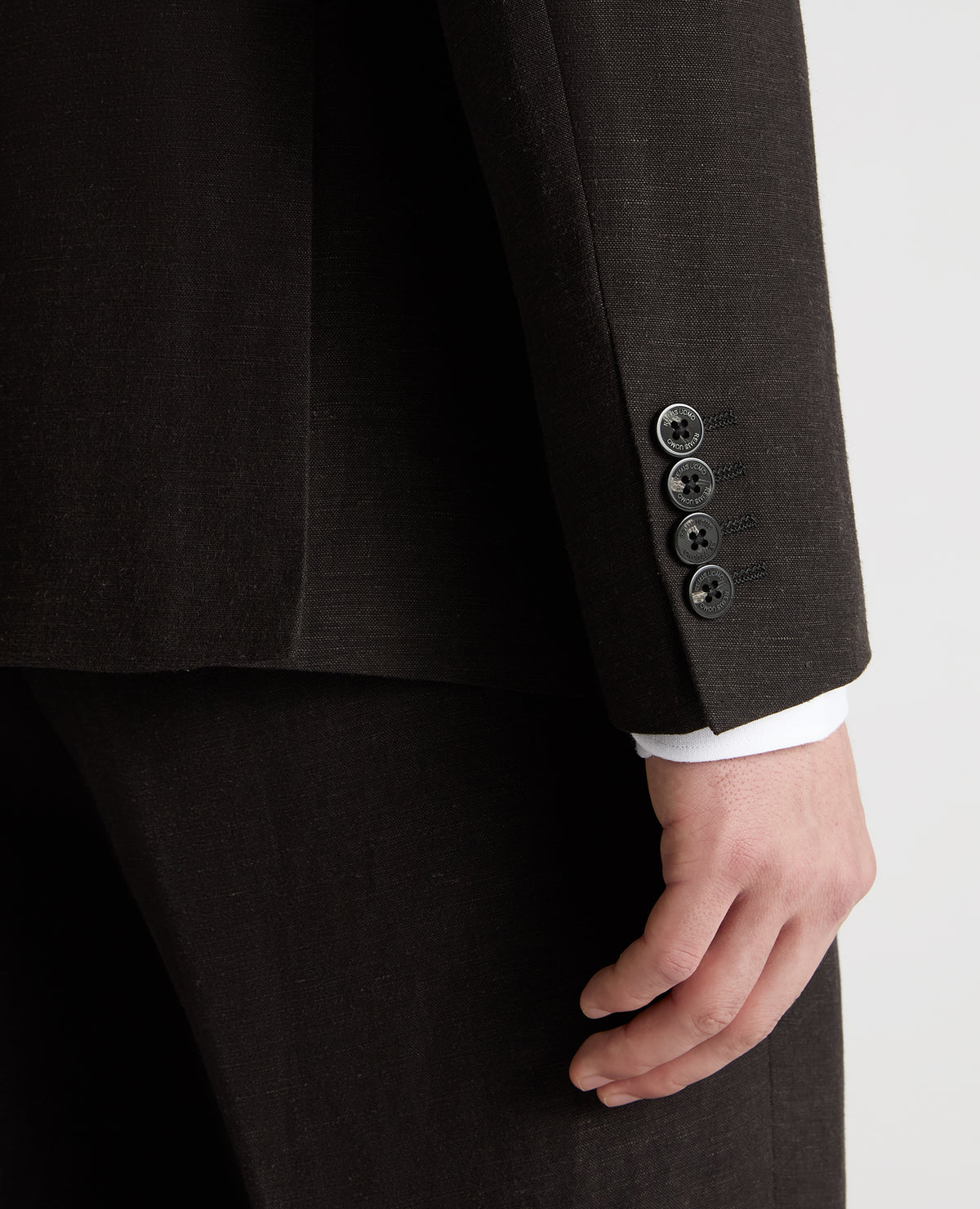 Man wearing a black Slim Fit Double-Breasted Linen-Blend Suit Jacket