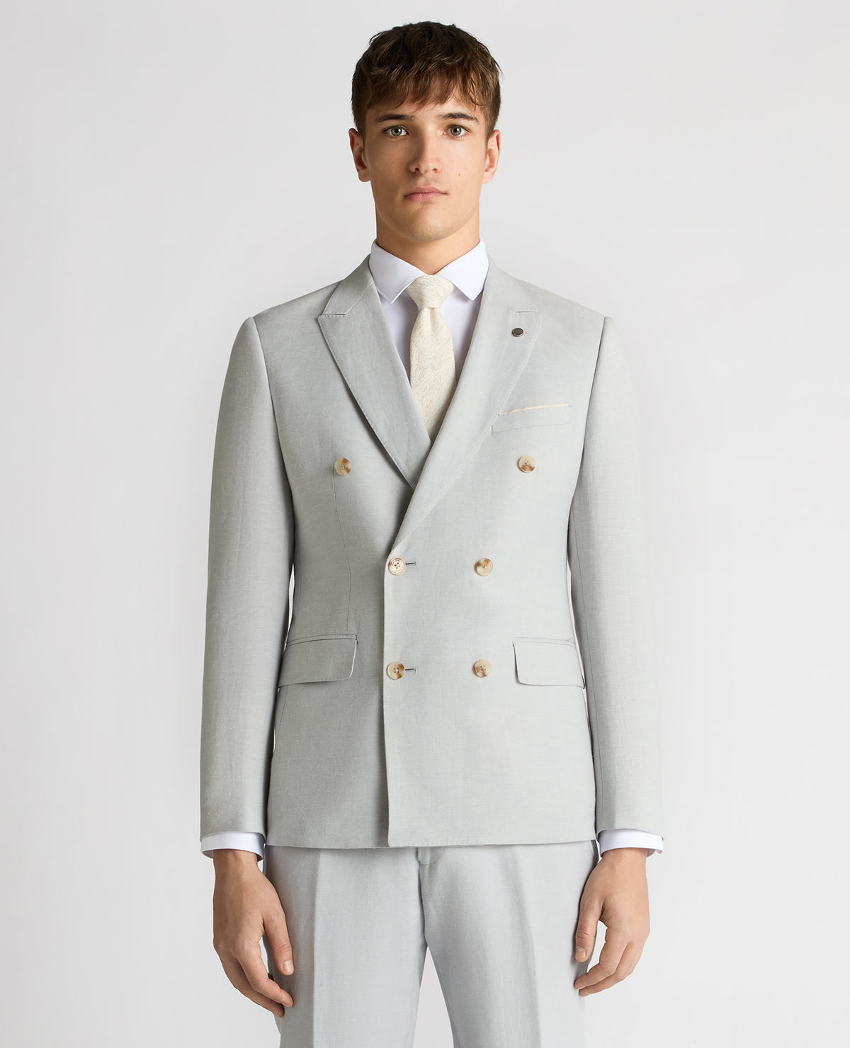 Man wearing a blue Slim Fit Linen-Blend Double Breasted Suit