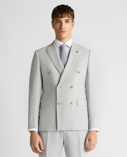 Man wearing a blue Slim Fit Double-Breasted Linen-Blend Suit Jacket