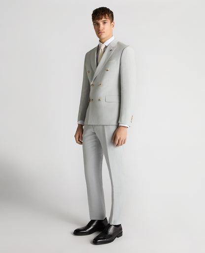 Man wearing a blue Slim Fit Linen-Blend Double Breasted Suit