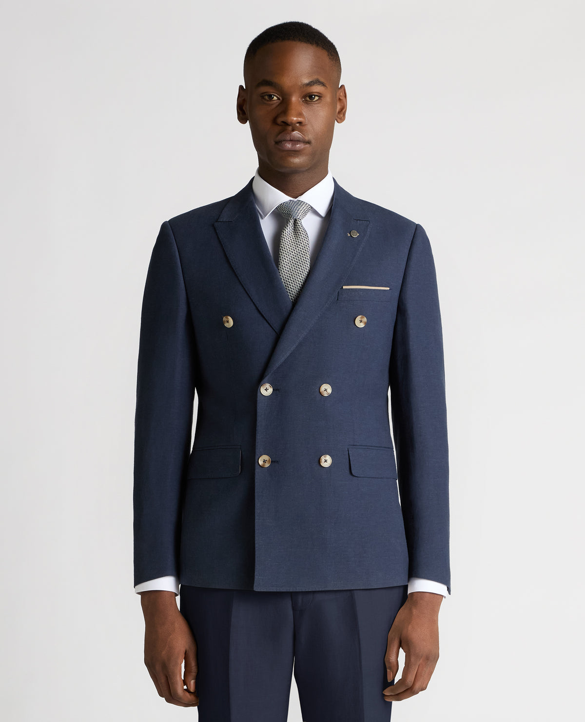 Man wearing a blue Slim Fit Linen-Blend Double Breasted Suit