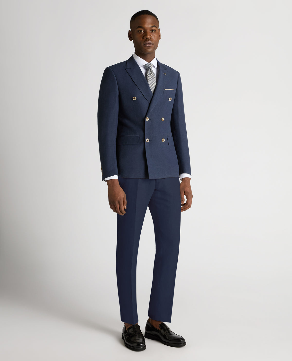 Man wearing a blue Slim Fit Linen-Blend Double Breasted Suit