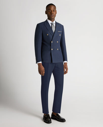 Man wearing a blue Slim Fit Linen-Blend Double Breasted Suit