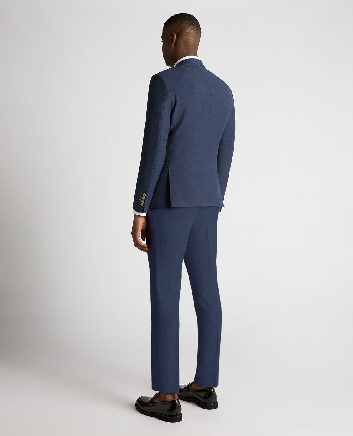 Man wearing a blue Slim Fit Linen-Blend Double Breasted Suit