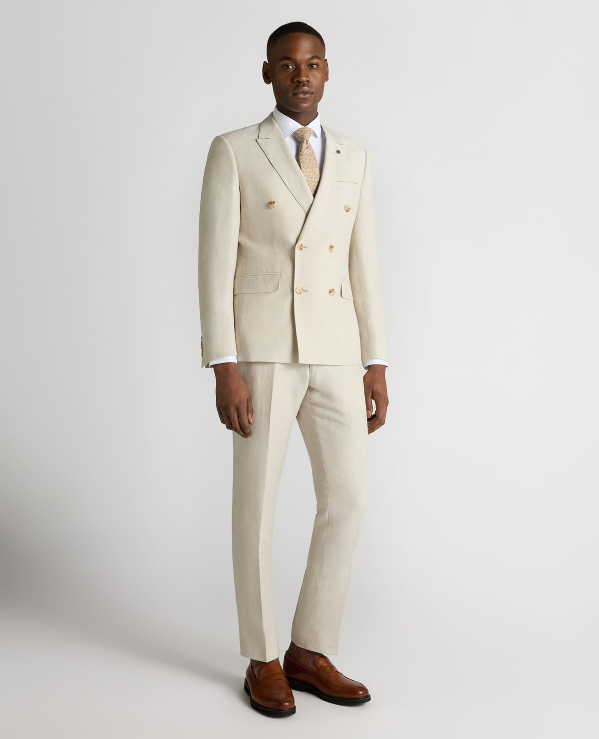 Man wearing a sand Slim Fit Linen-Blend Double Breasted Suit