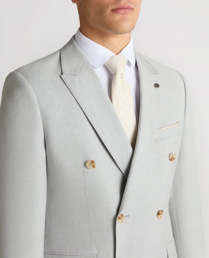 Man wearing a blue Slim Fit Double-Breasted Linen-Blend Suit Jacket