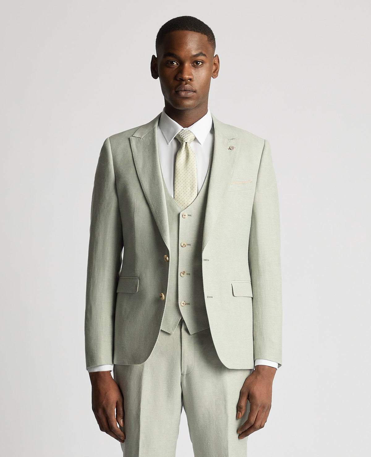 Man wearing a green Slim Fit Linen-Blend Suit