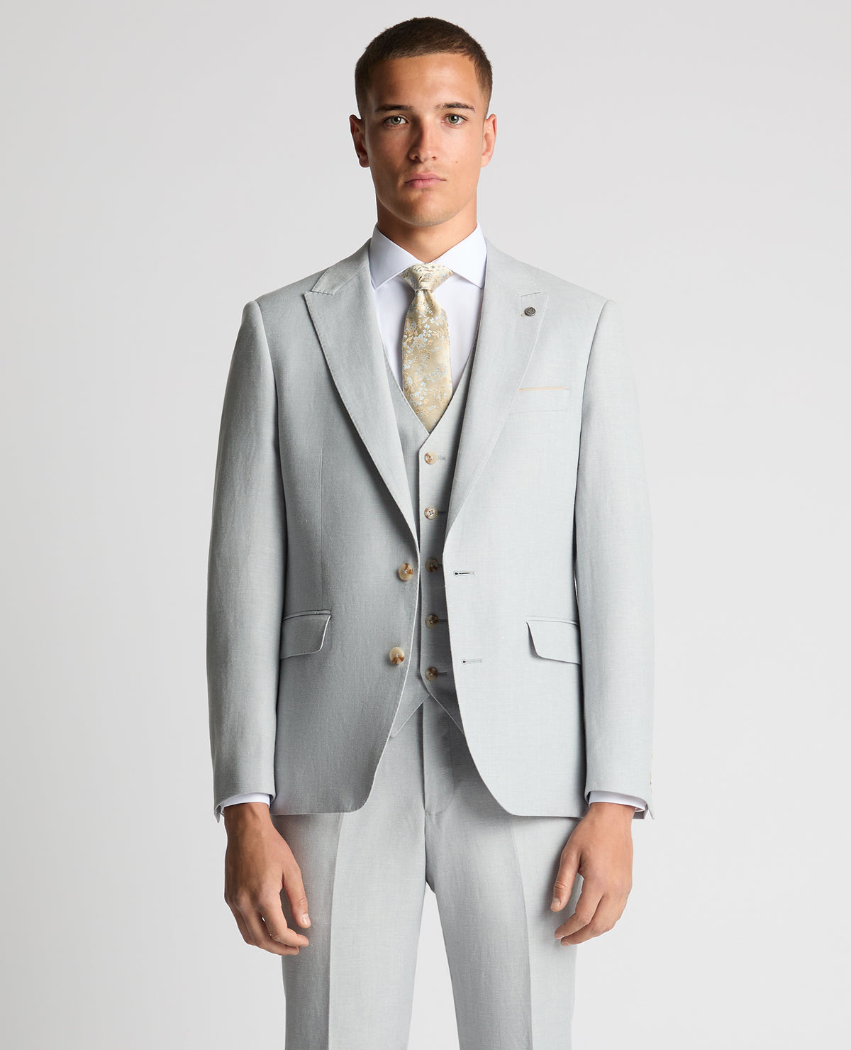 Man wearing a blue Tapered Fit Linen-Blend Suit Jacket