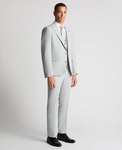 Man wearing a blue Tapered Fit Linen-Blend Suit Jacket