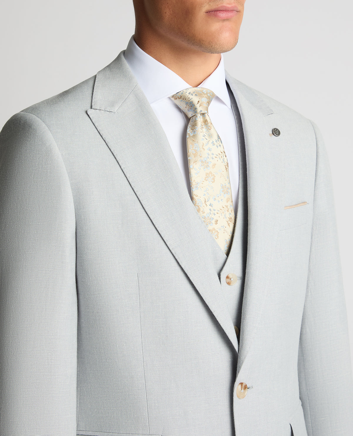 Man wearing a blue Tapered Fit Linen-Blend Suit Jacket