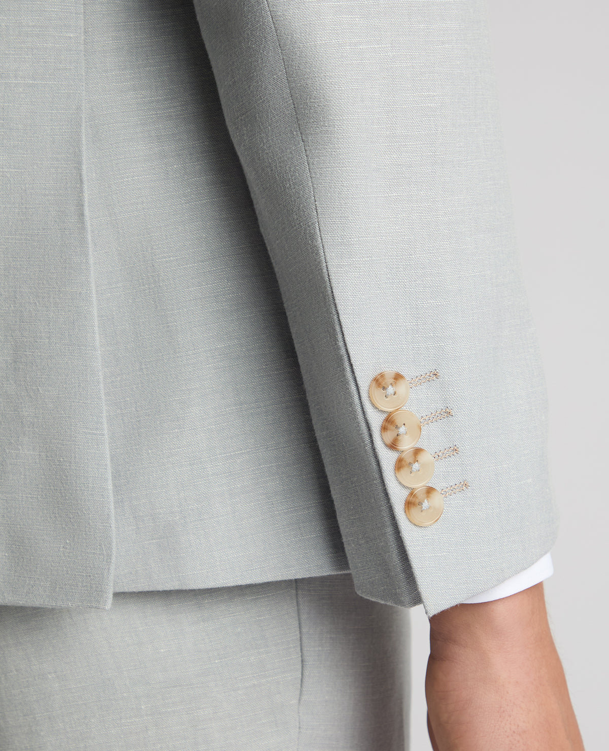 Man wearing a blue Tapered Fit Linen-Blend Suit Jacket