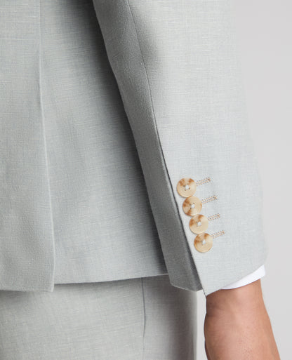 Man wearing a blue Tapered Fit Linen-Blend Suit Jacket