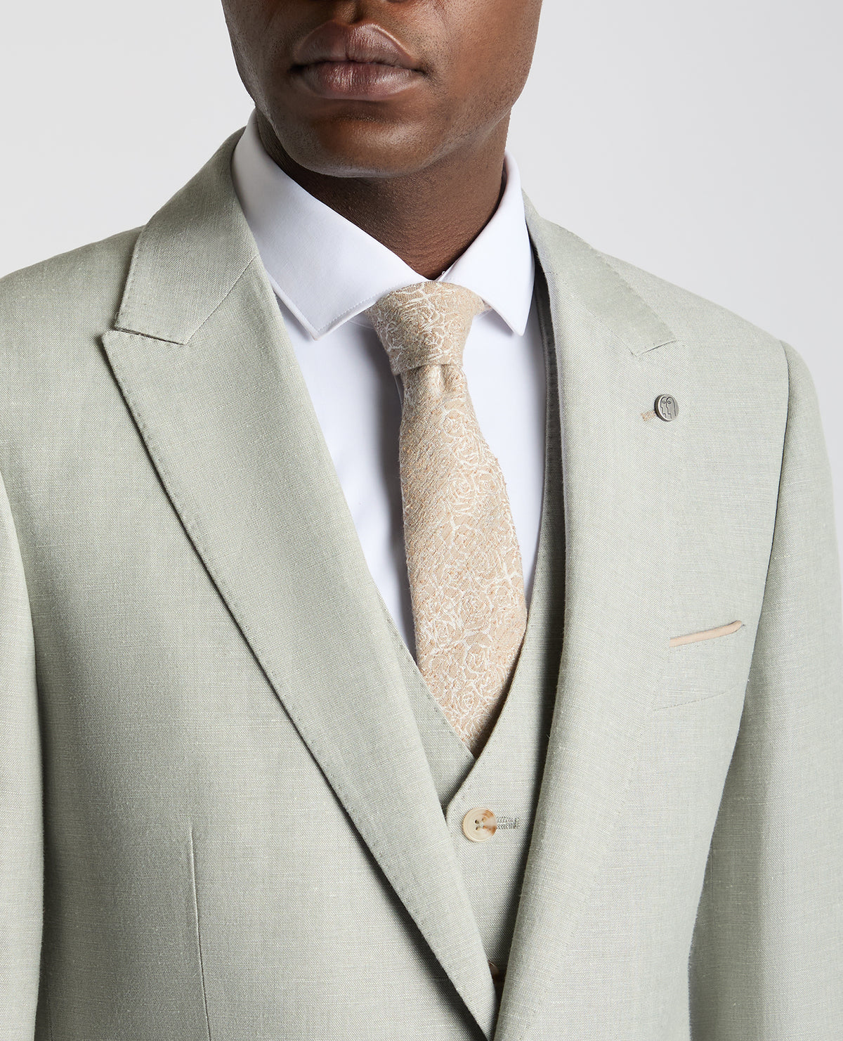 Man wearing a green Tapered Fit Linen-Blend Suit