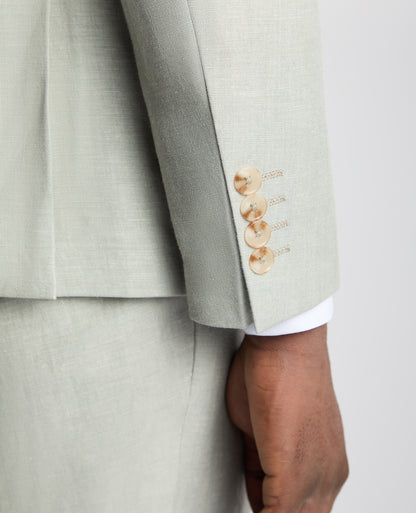 Man wearing a green Tapered Fit Linen-Blend Suit