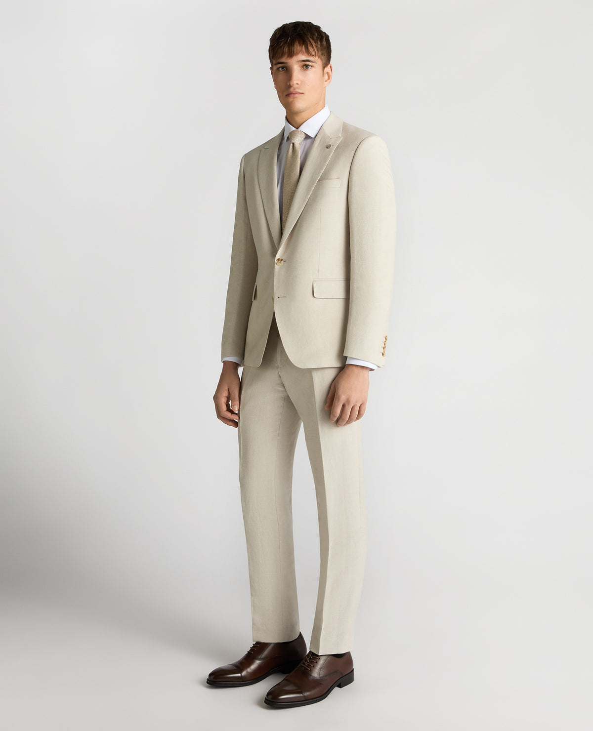 Man wearing a cream suit