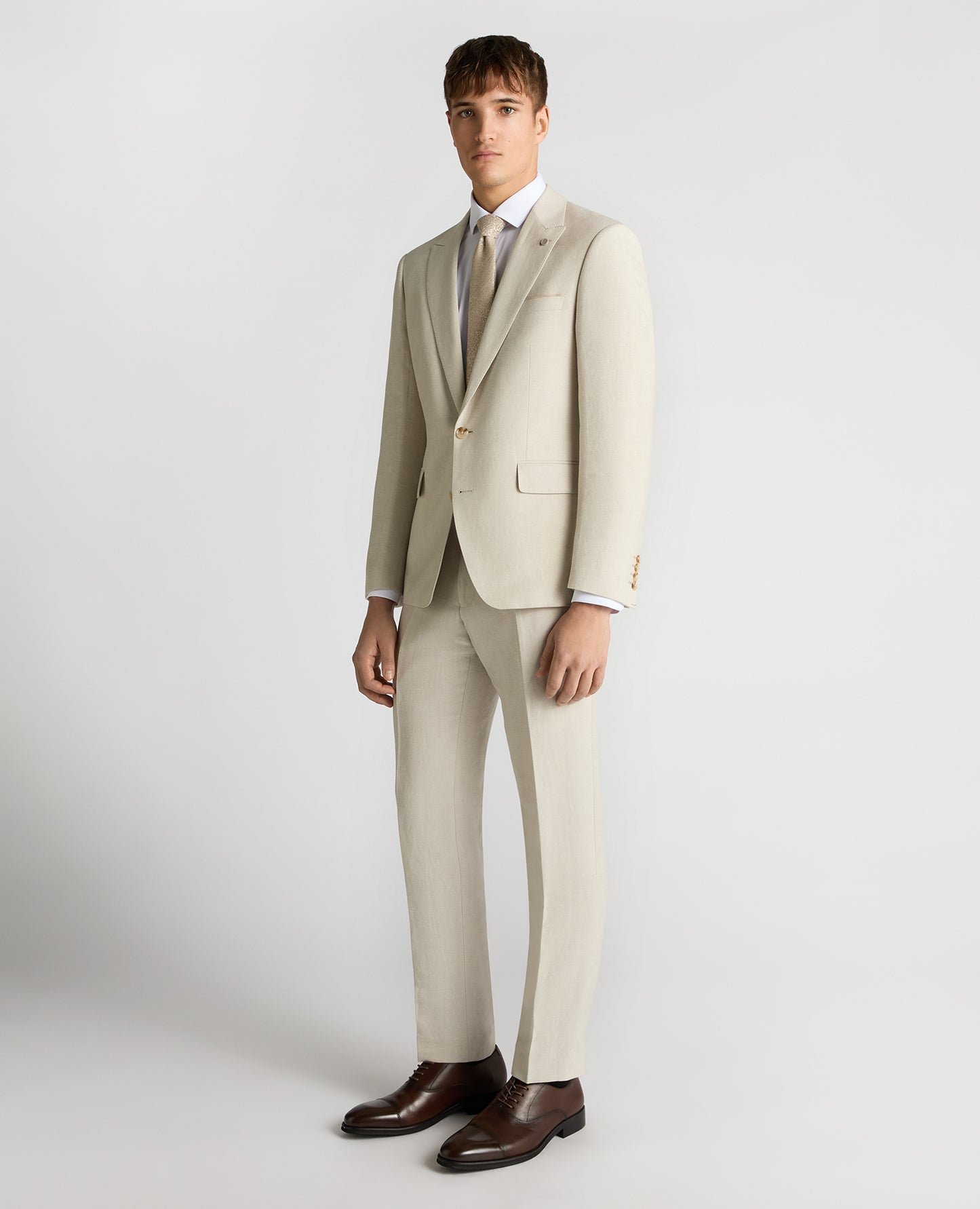 Man wearing a cream suit
