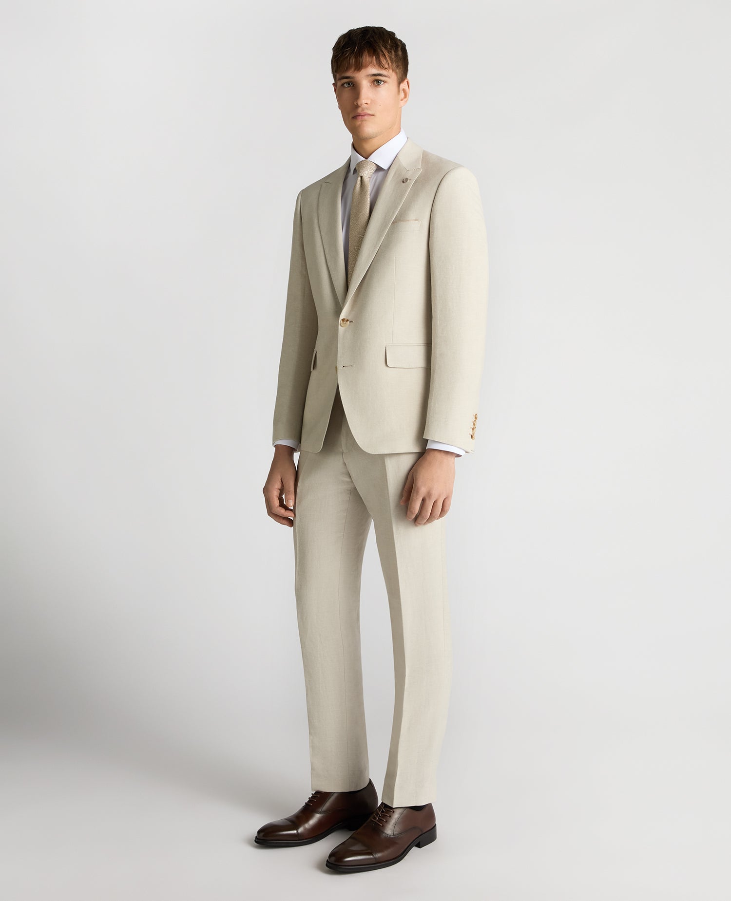 Man wearing a cream suit