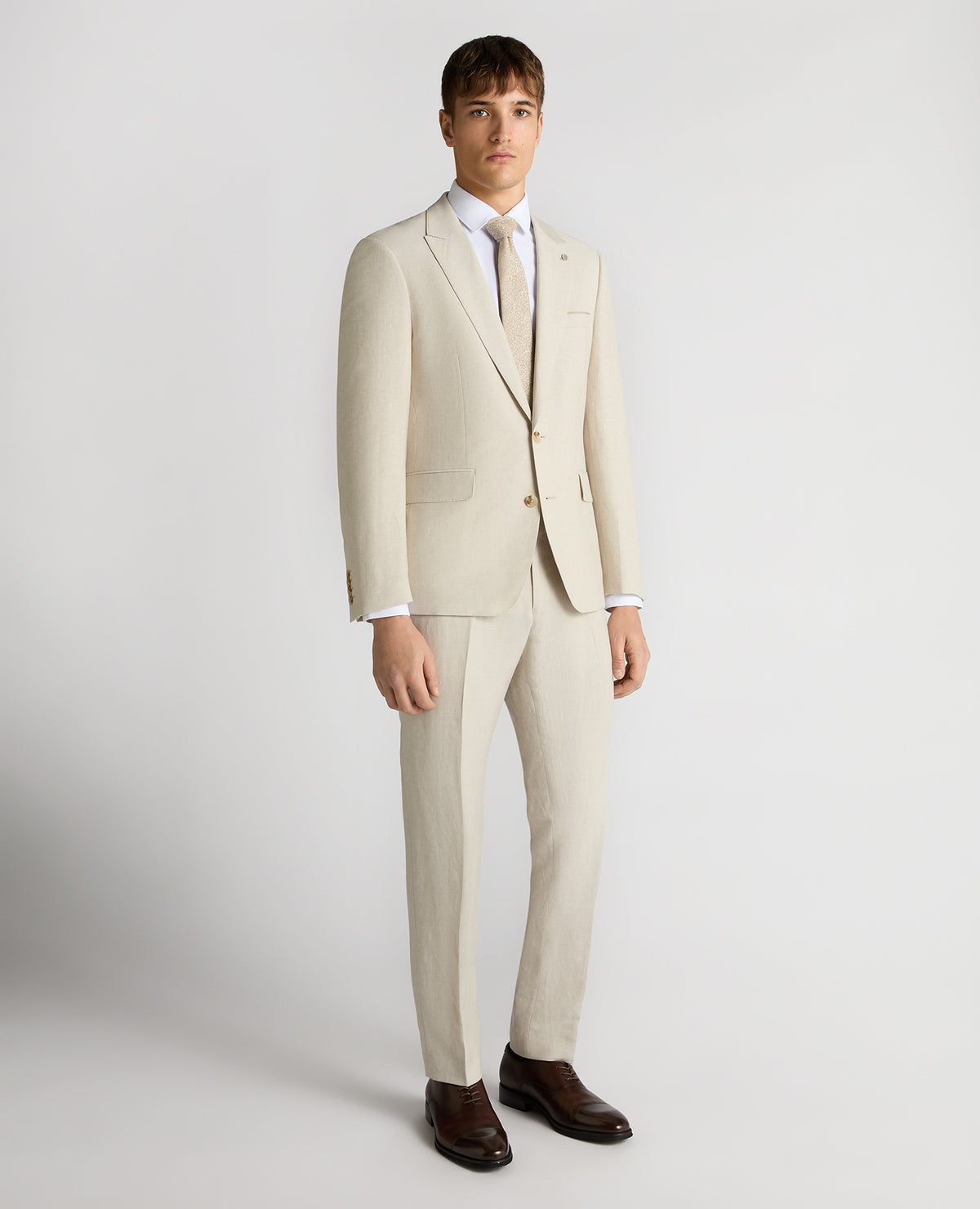 Man wearing a sand Tapered Fit Linen-Blend Suit Jacket