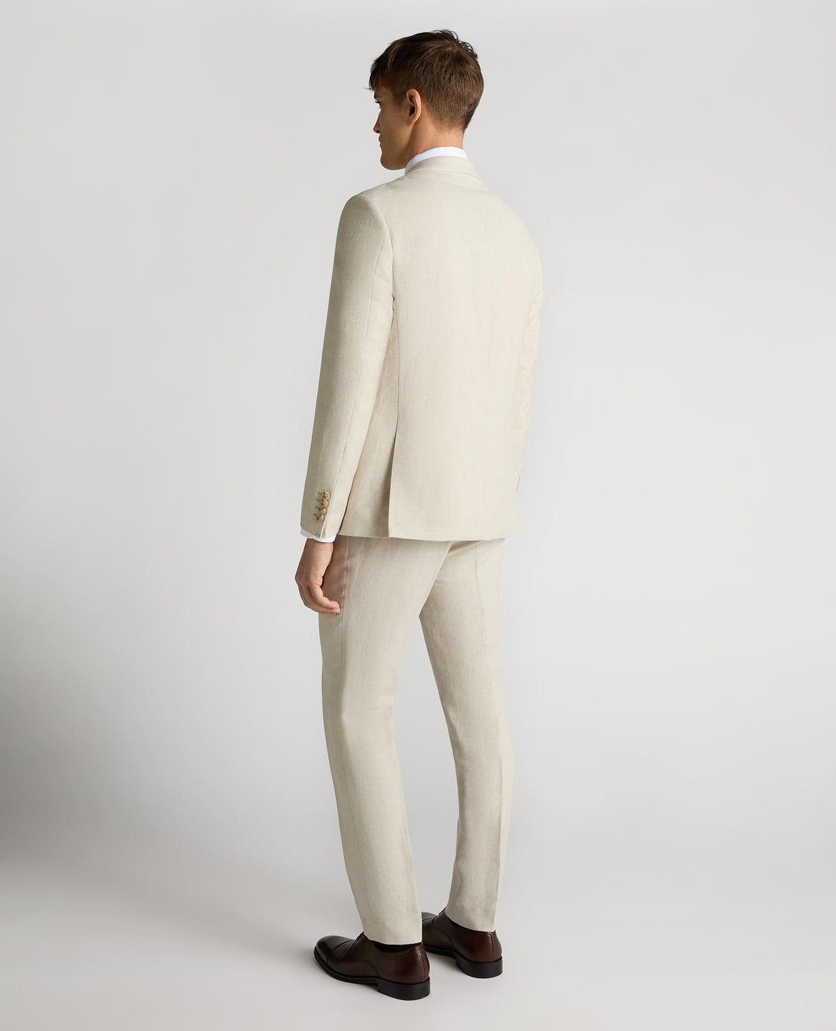Man wearing a sand Tapered Fit Linen-Blend Suit Jacket
