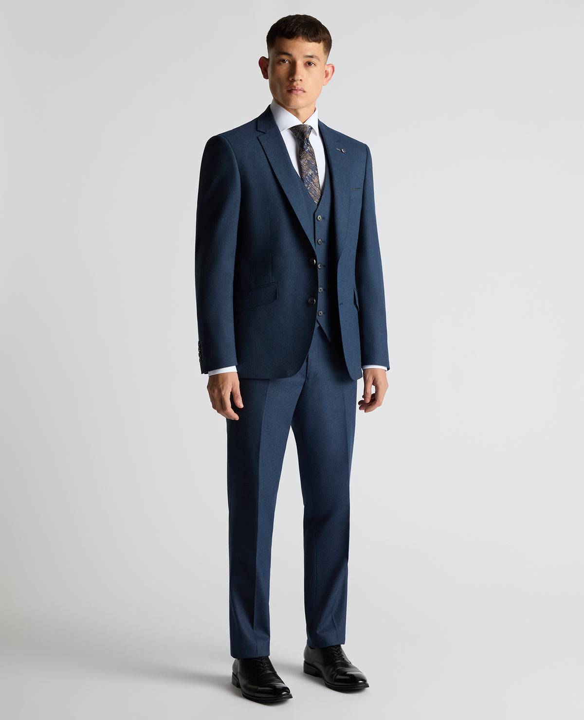 Man wearing a blue Tapered Fit Stretch Suit