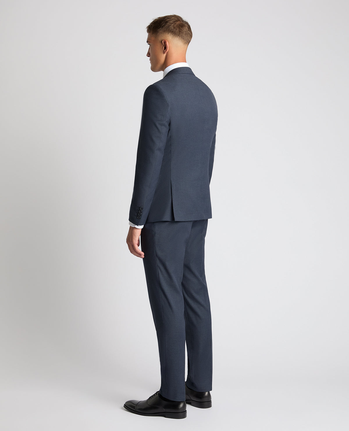 Man wearing a blue Slim Fit Checked Stretch Suit