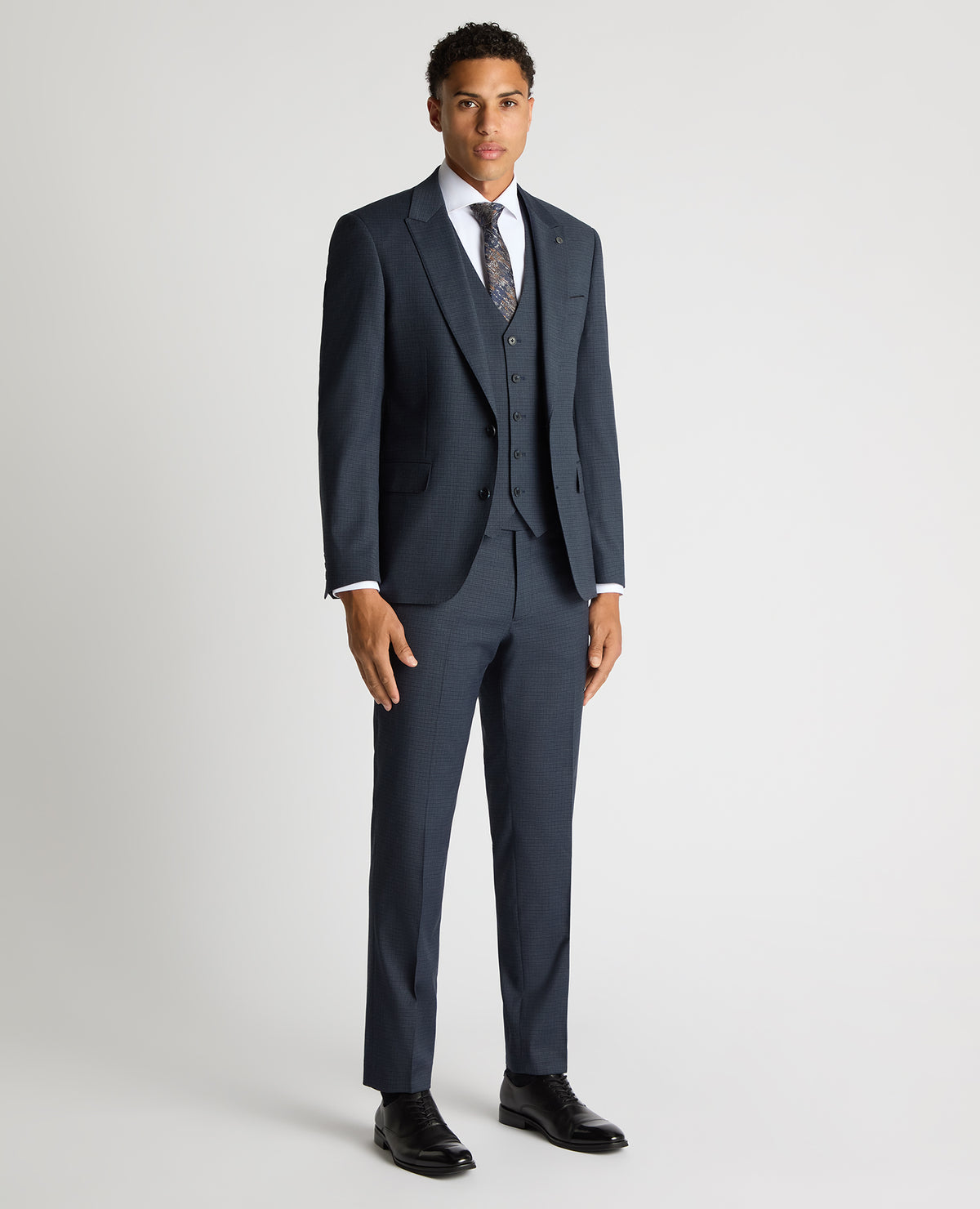 Man wearing a blue Tapered Fit Checked Stretch Suit