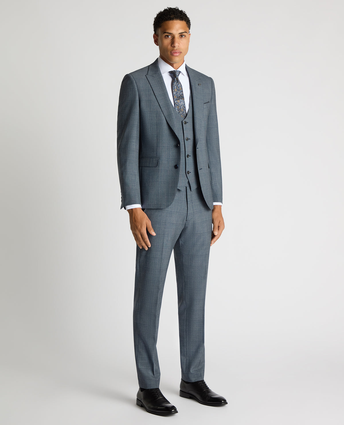 Man wearing a blue Slim Fit Checked Stretch Suit Jacket