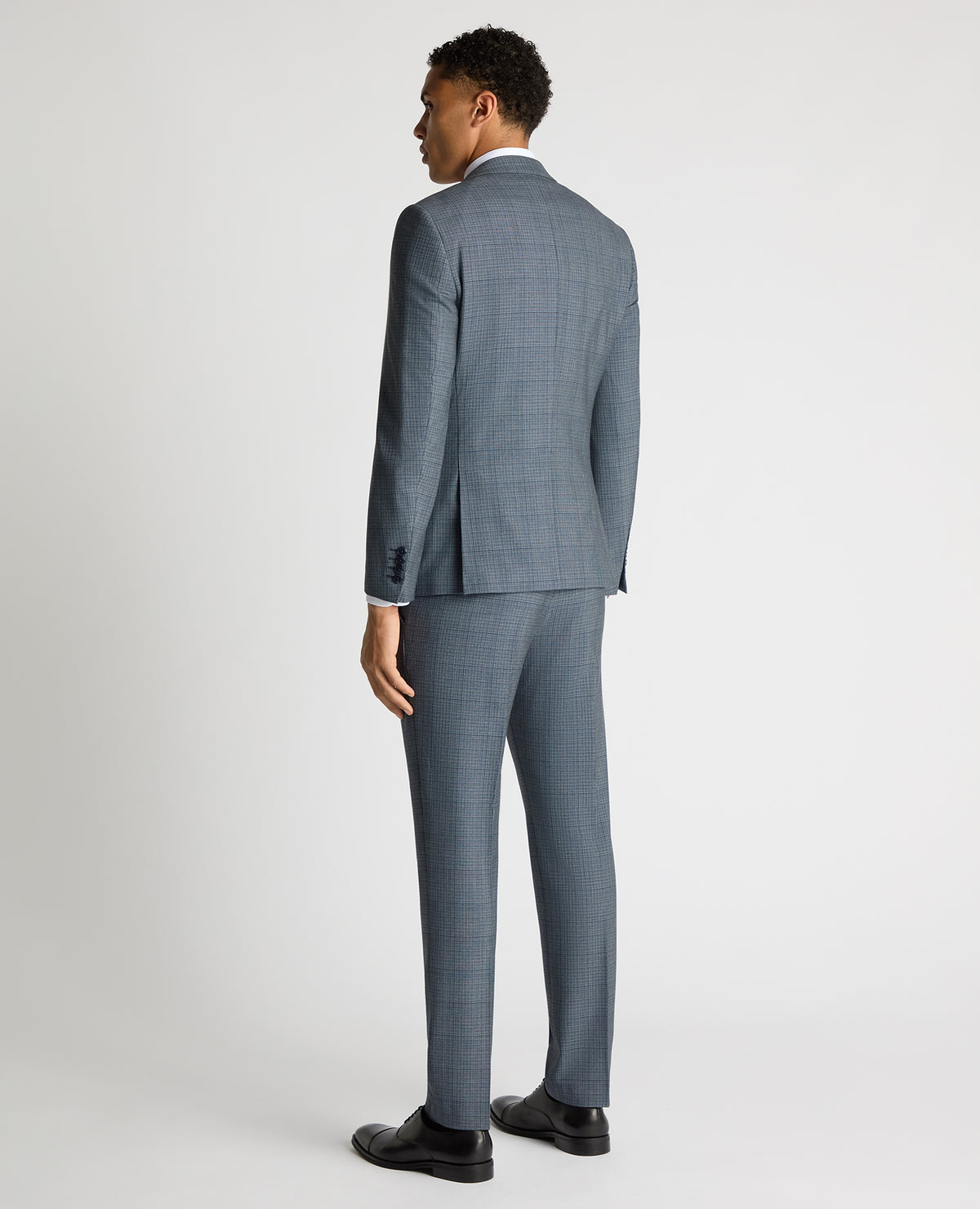 Man wearing a blue Slim Fit Checked Stretch Suit Jacket