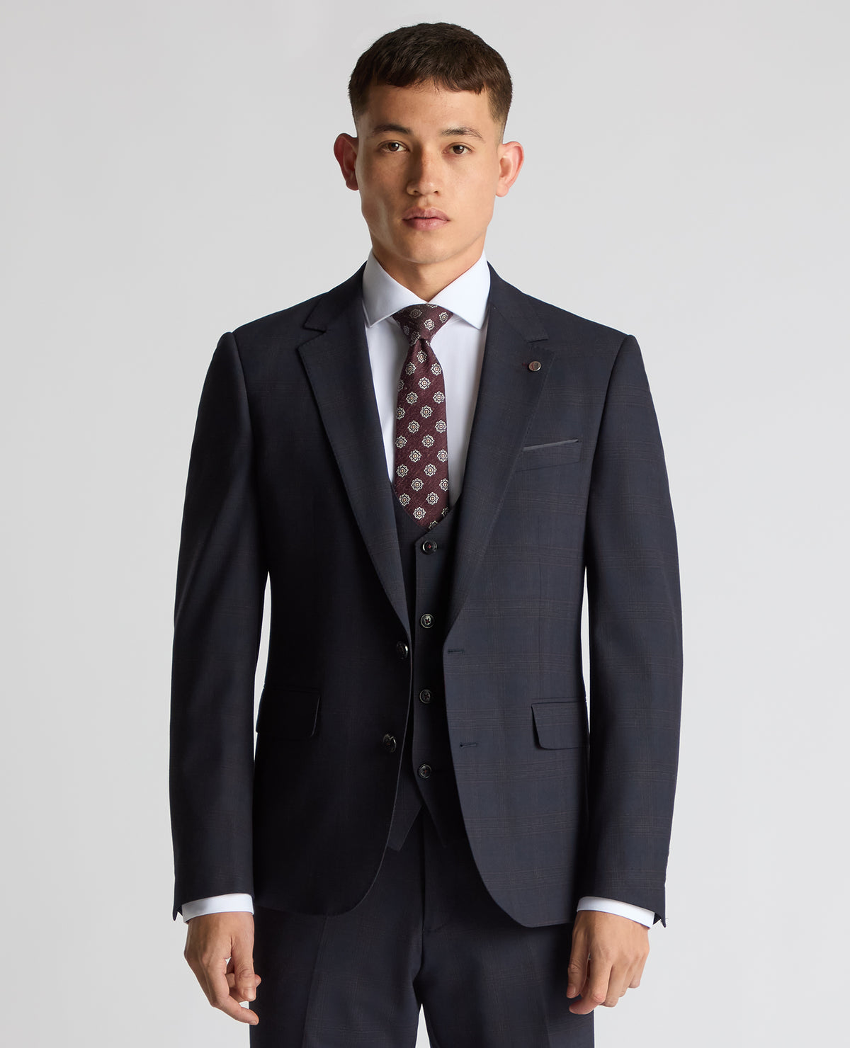 Man wearing a navy Slim Fit Checked Stretch Suit