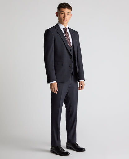 Man wearing a navy Slim Fit Checked Stretch Suit